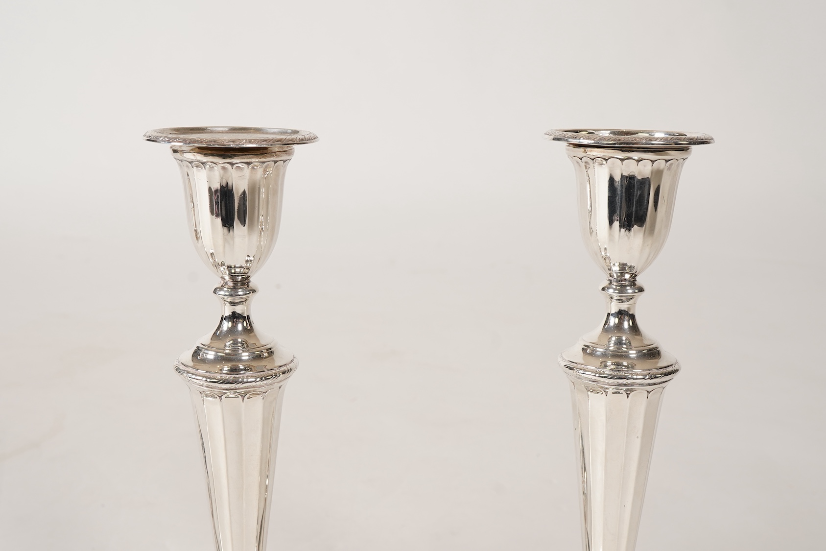 A set of four George III silver candlesticks, by John Green, Roberts, Mosley & Co